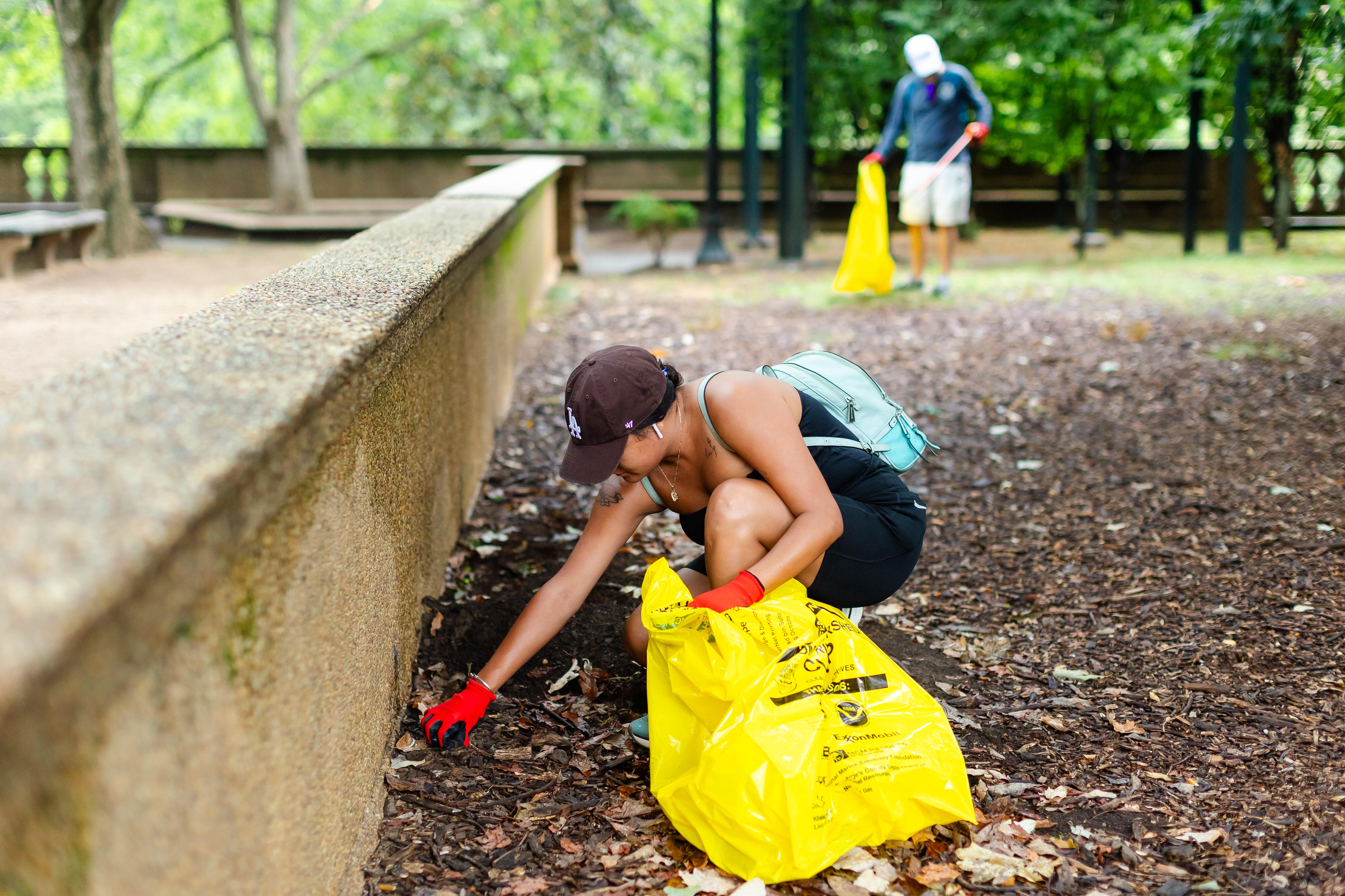 Volunteer cleaning up trash at Meridian Hill Park